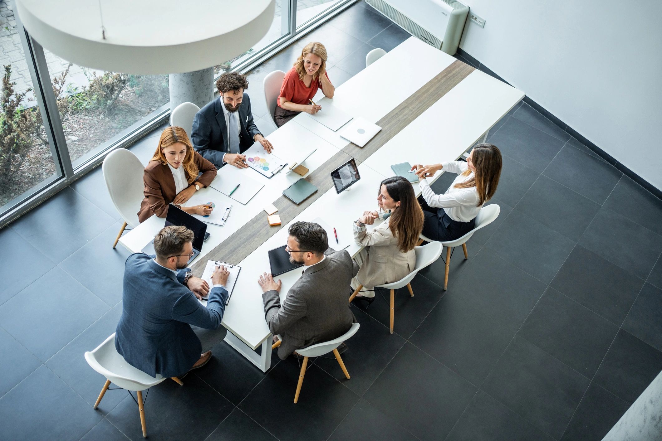 Business people having corporate meeting in modern conference room